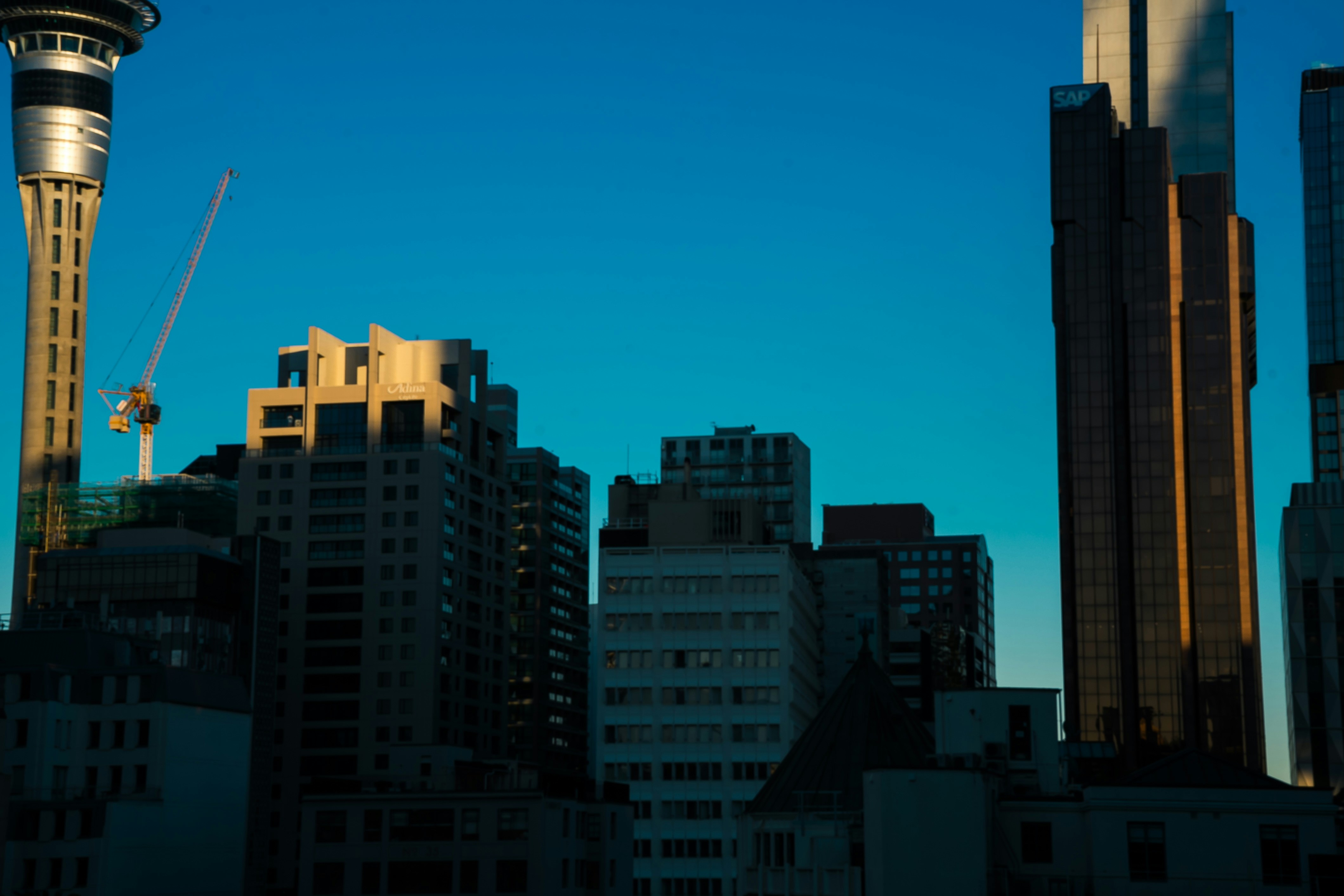 Modern city skyline with skyscrapers under clear sky
