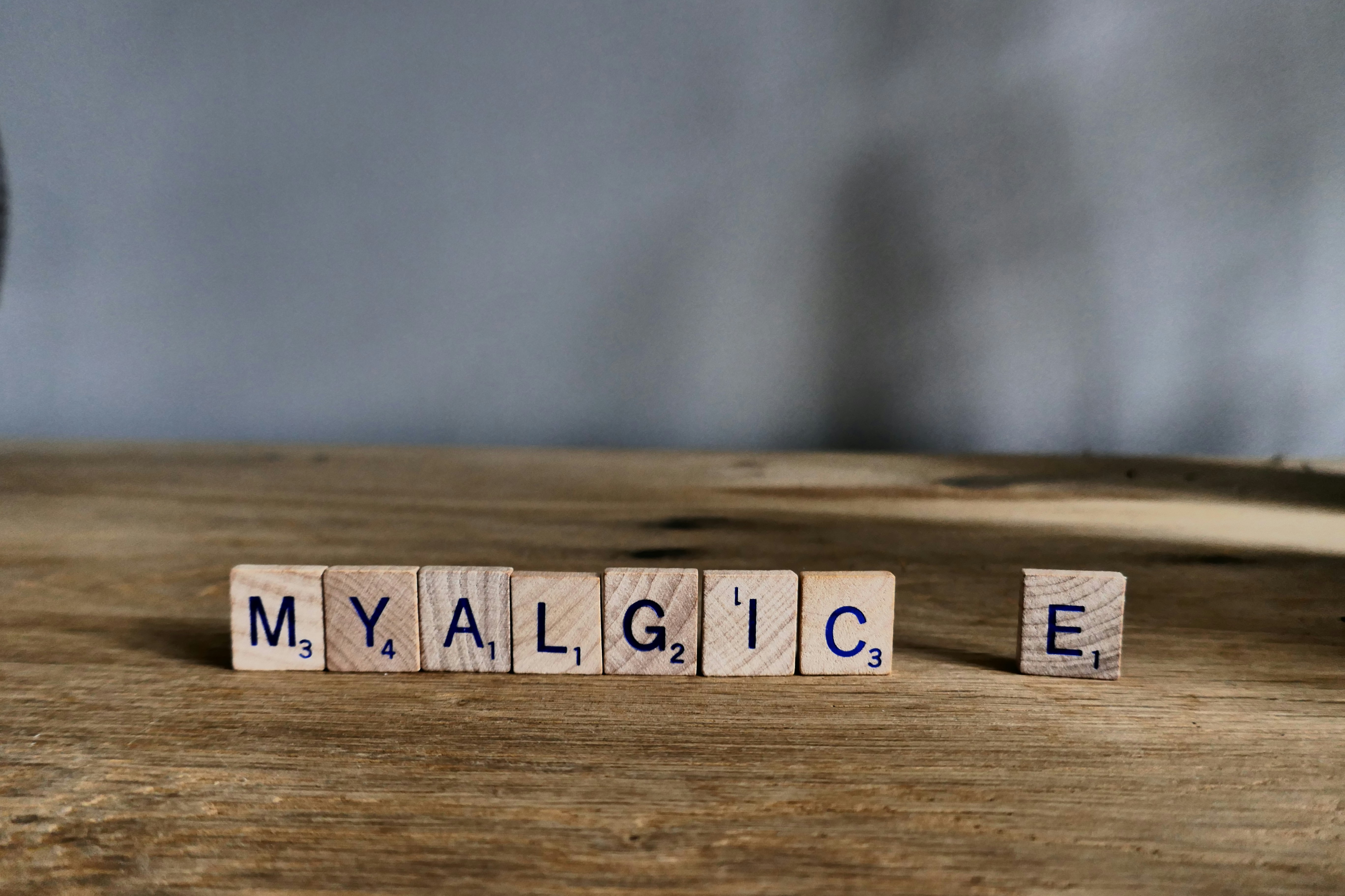Scrabble tiles spelling out Myalgic E