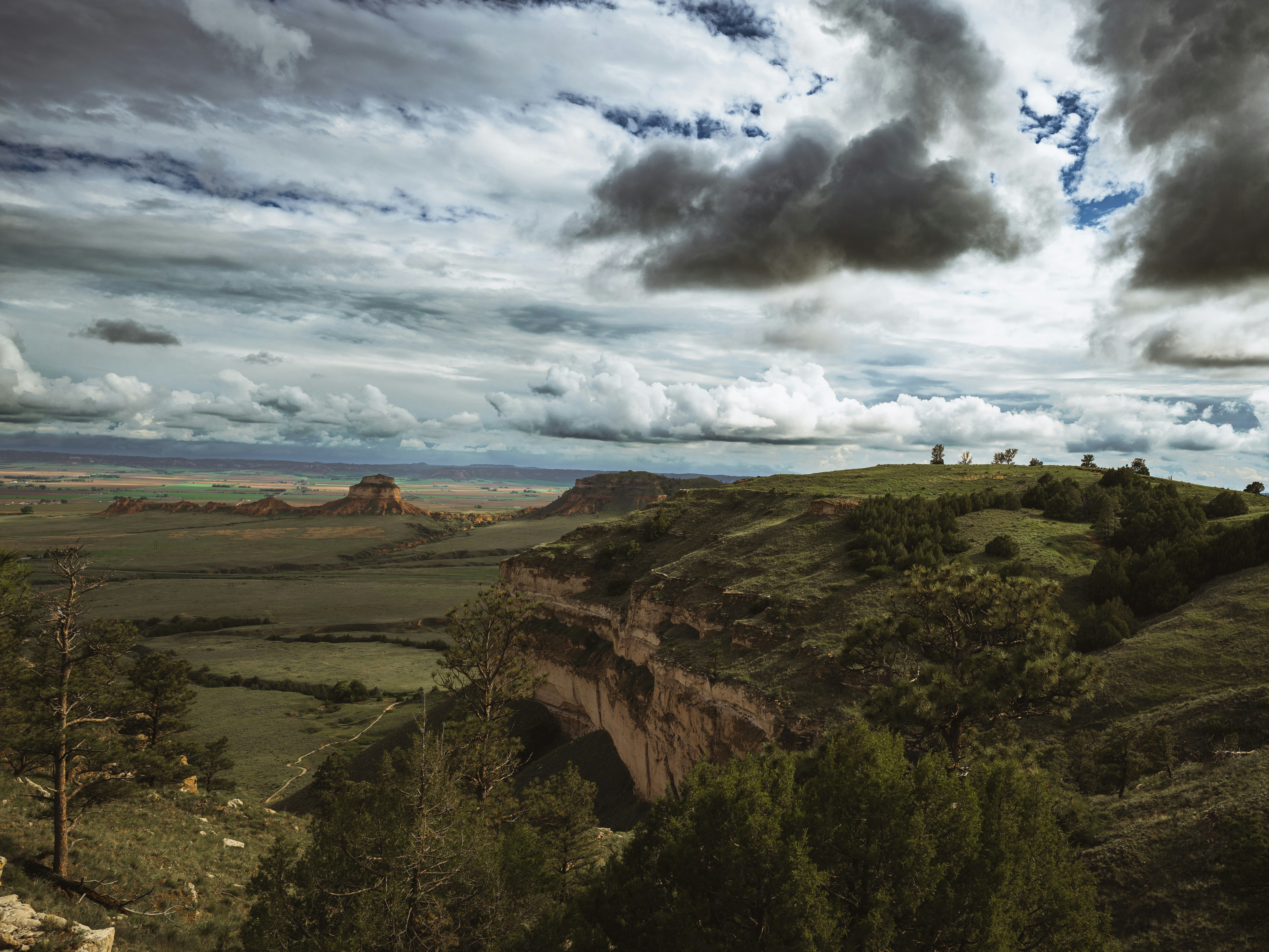 Dramatic cloudy sky over a vast desert landscape