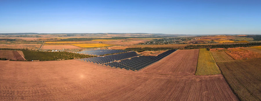 Solar panels installed across a vast agricultural landscape