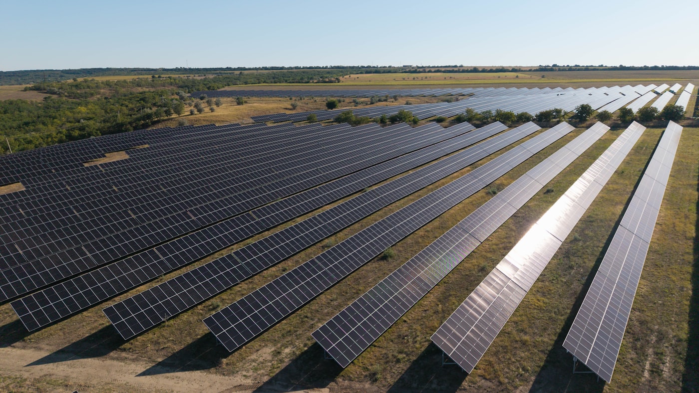 Rows of solar panels across a large field
