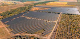Vast solar panel farm in a rural landscape