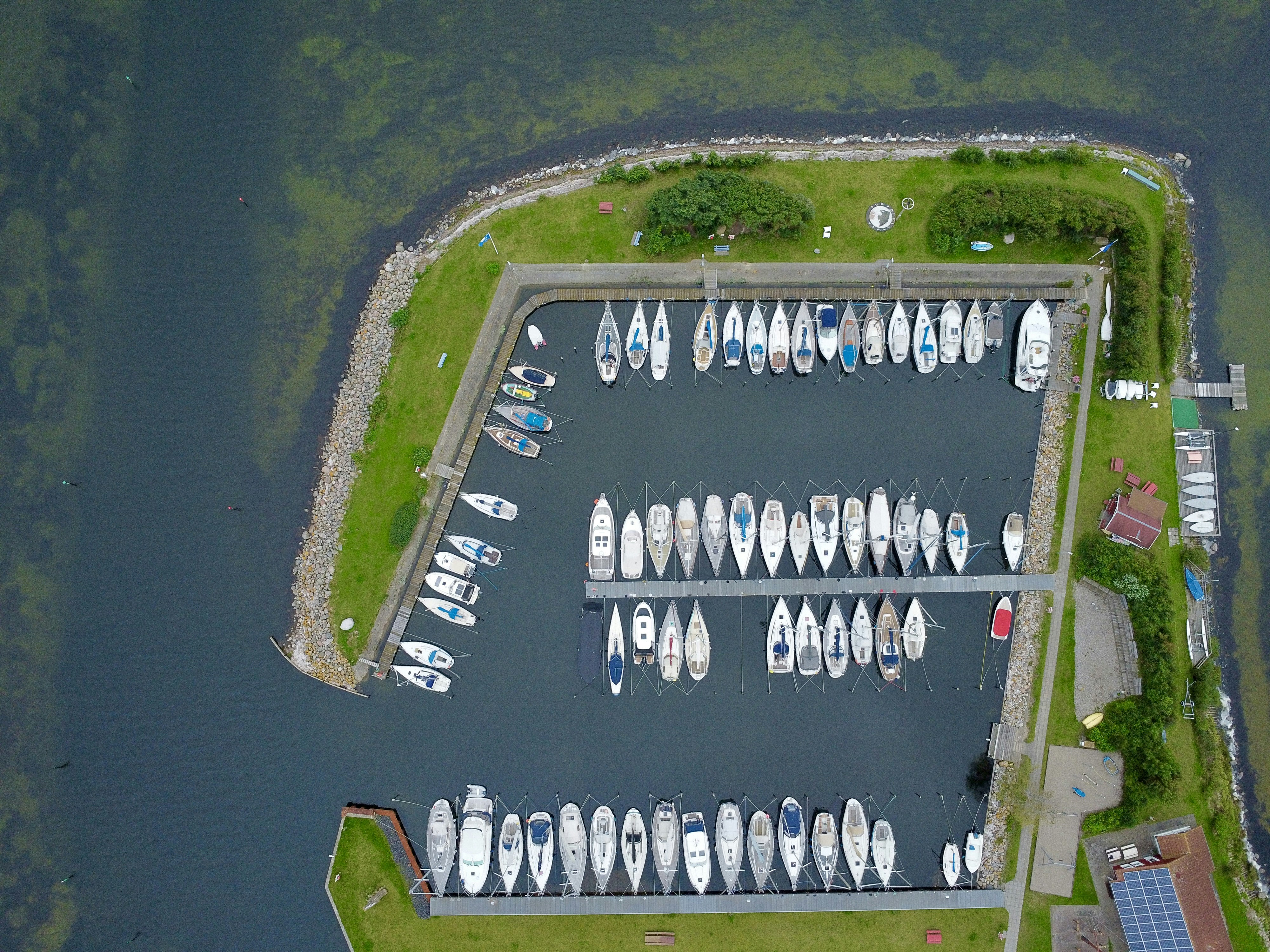 Aerial view of a marina filled with docked boats