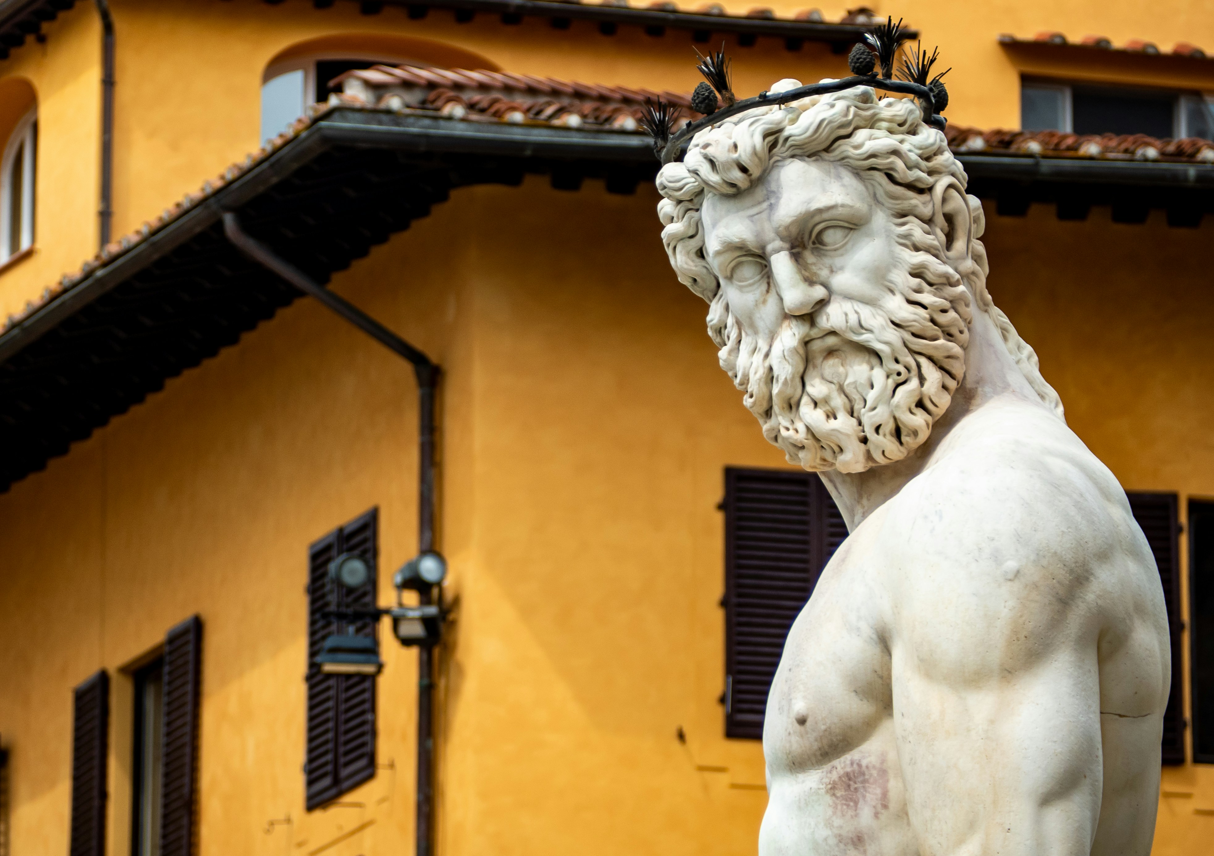 Marble statue of a bearded man with crown