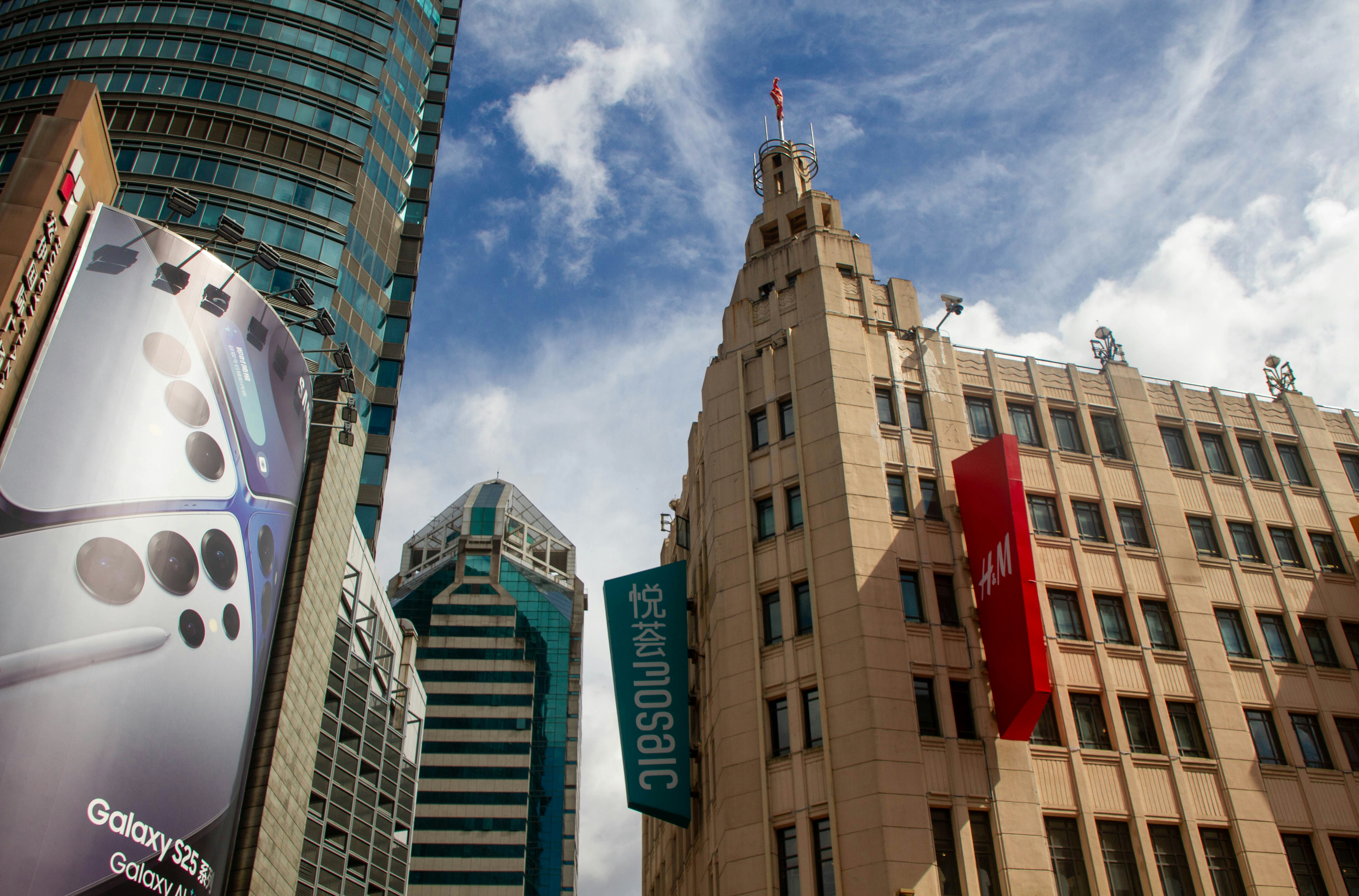 Modern skyscrapers against a cloudy blue sky