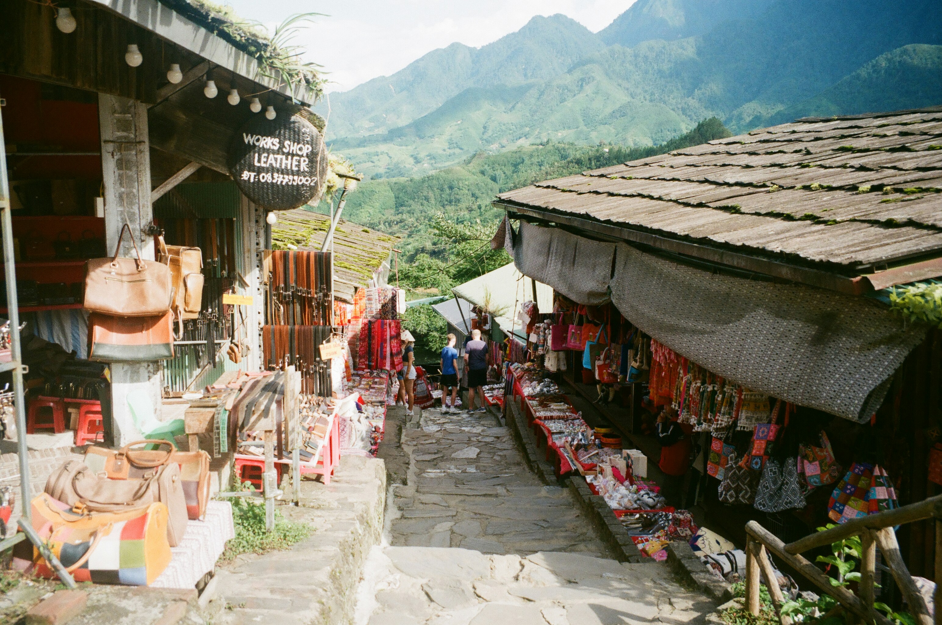 Mountain village market with colorful goods and vendors