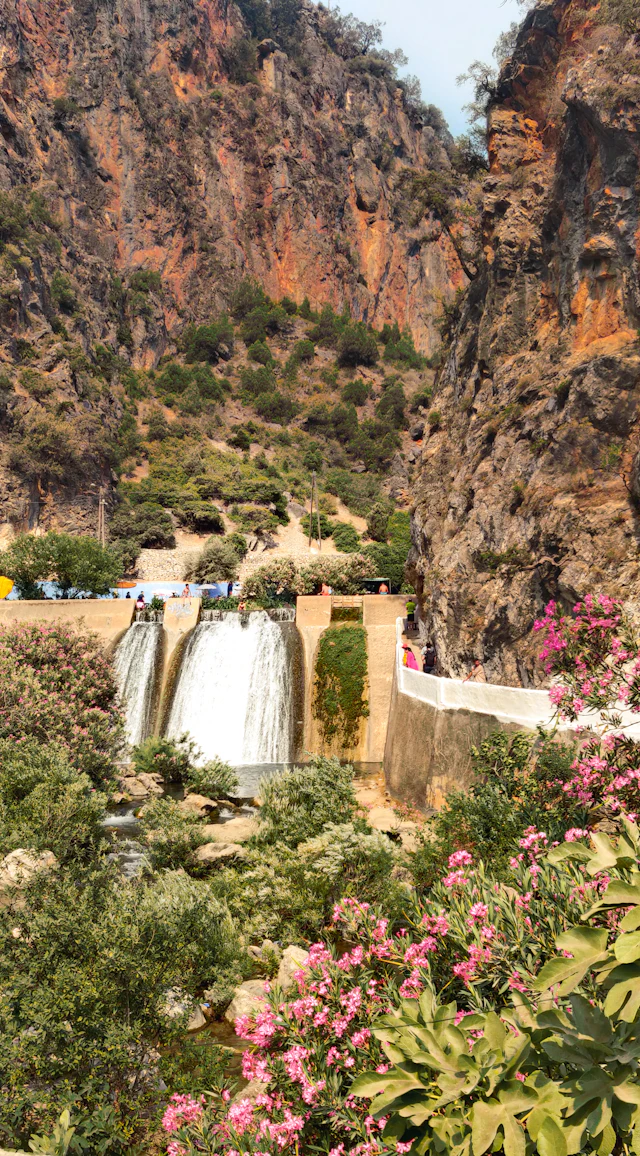 Waterfalls flowing between rocky cliffs