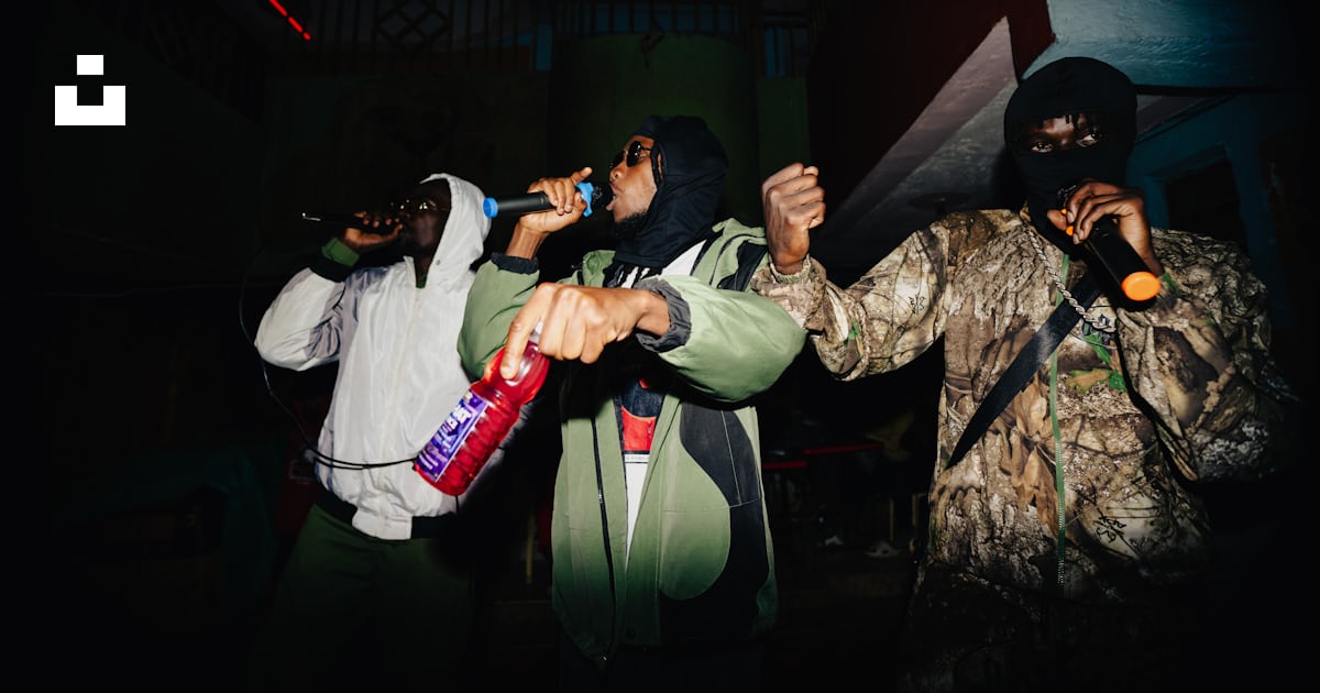 Three people rapping into microphones on stage. photo – Free People ...