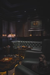 Dark wood-paneled lounge at warm low light