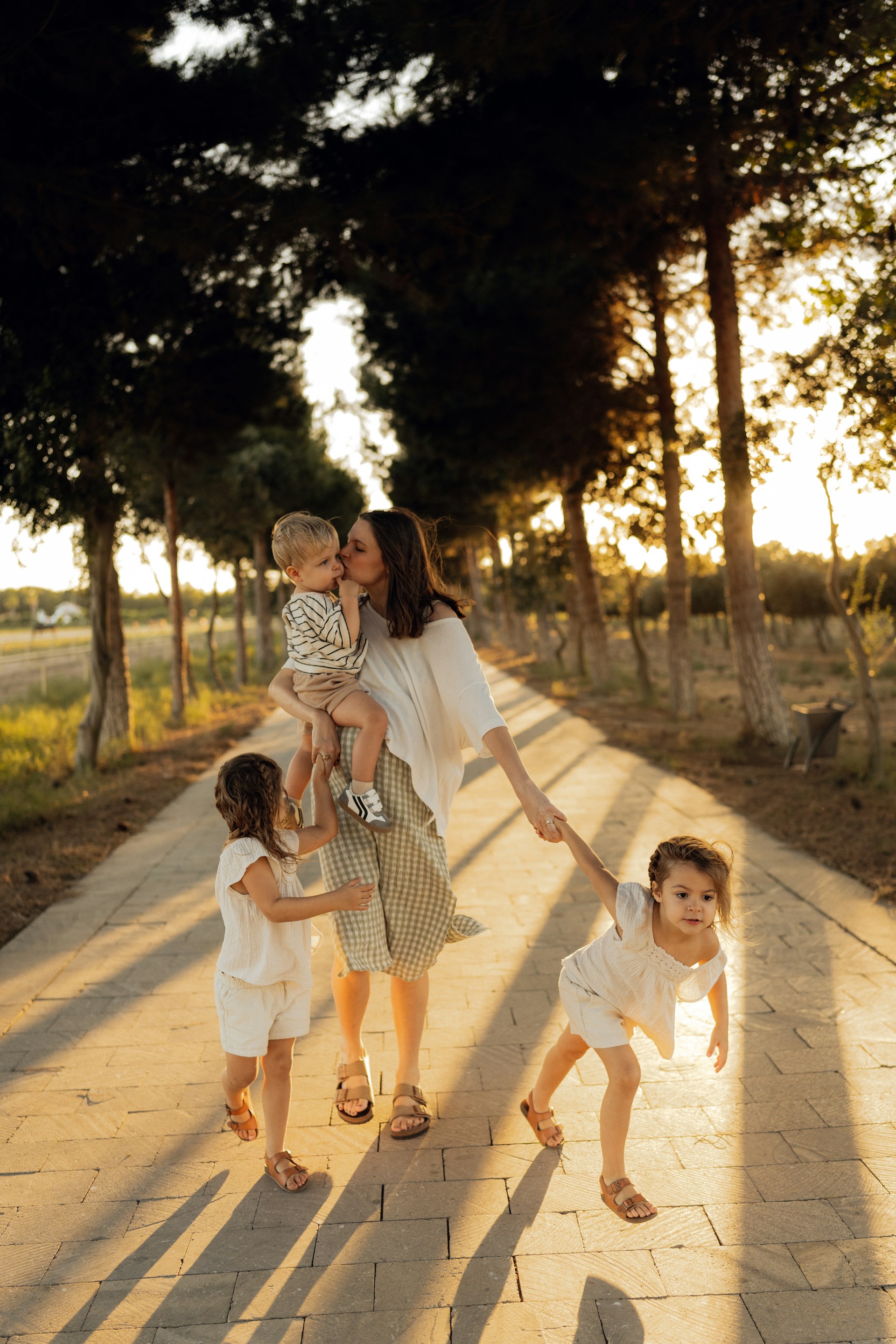 Mother with three children walking on a path