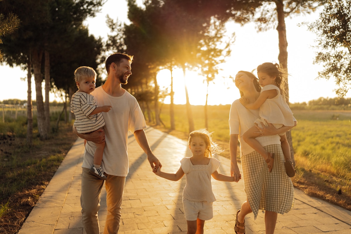 Family walking together at sunset