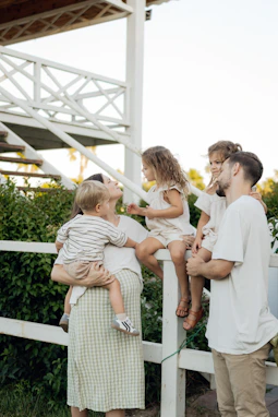 Family enjoying time together on a porch.
