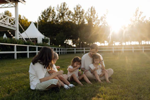 Family enjoying a sunny day on the grass