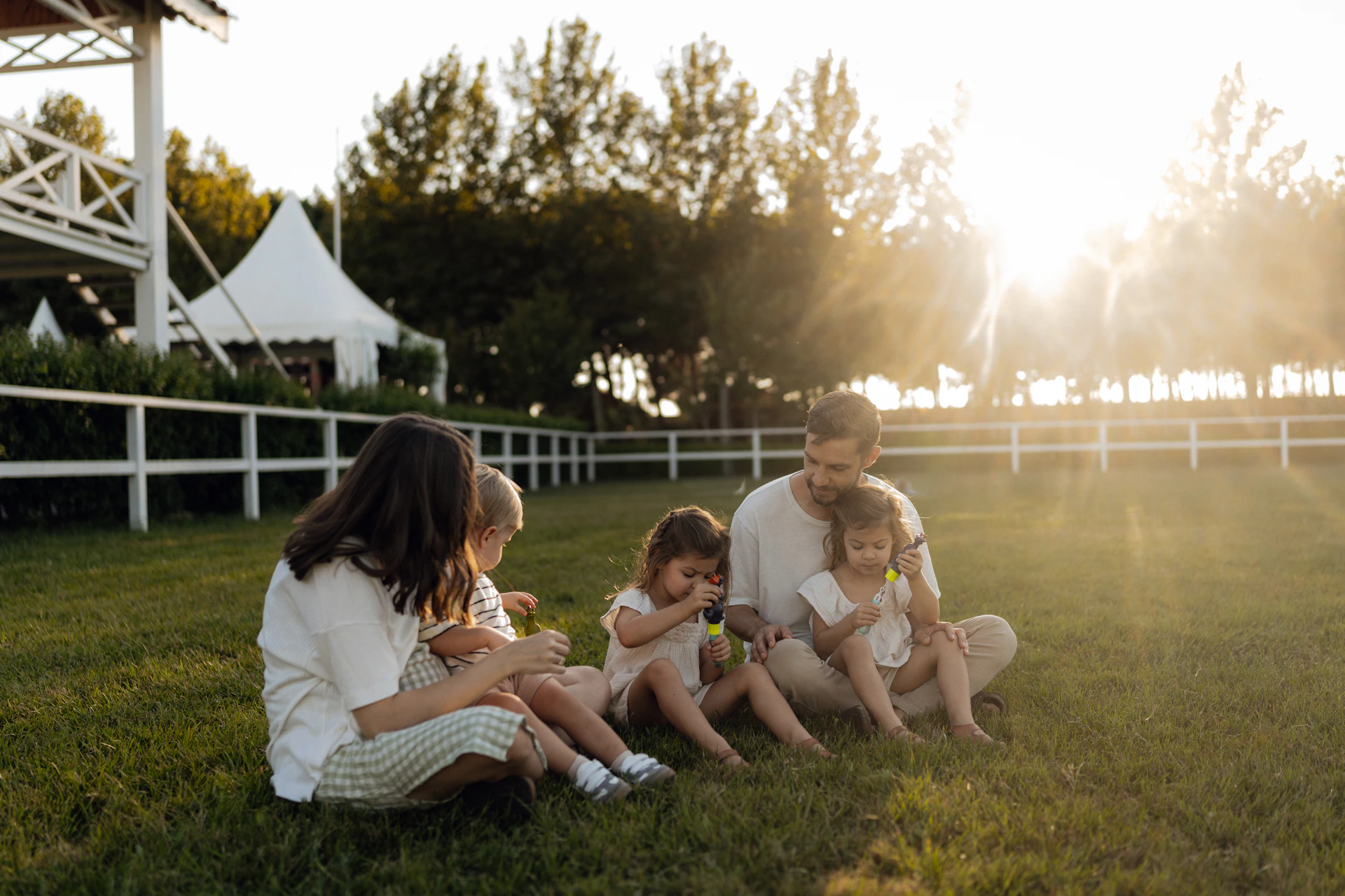 Family enjoying a sunny day on the grass