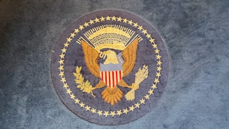 The great seal of the united states on a rug.