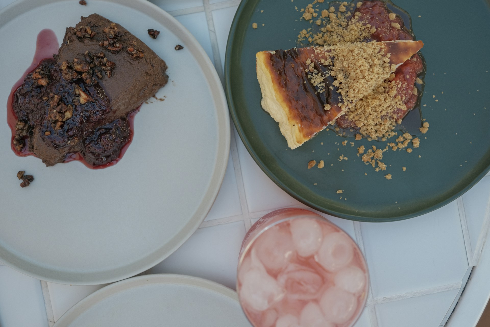 Two slices of dessert with fruit and crumbs.