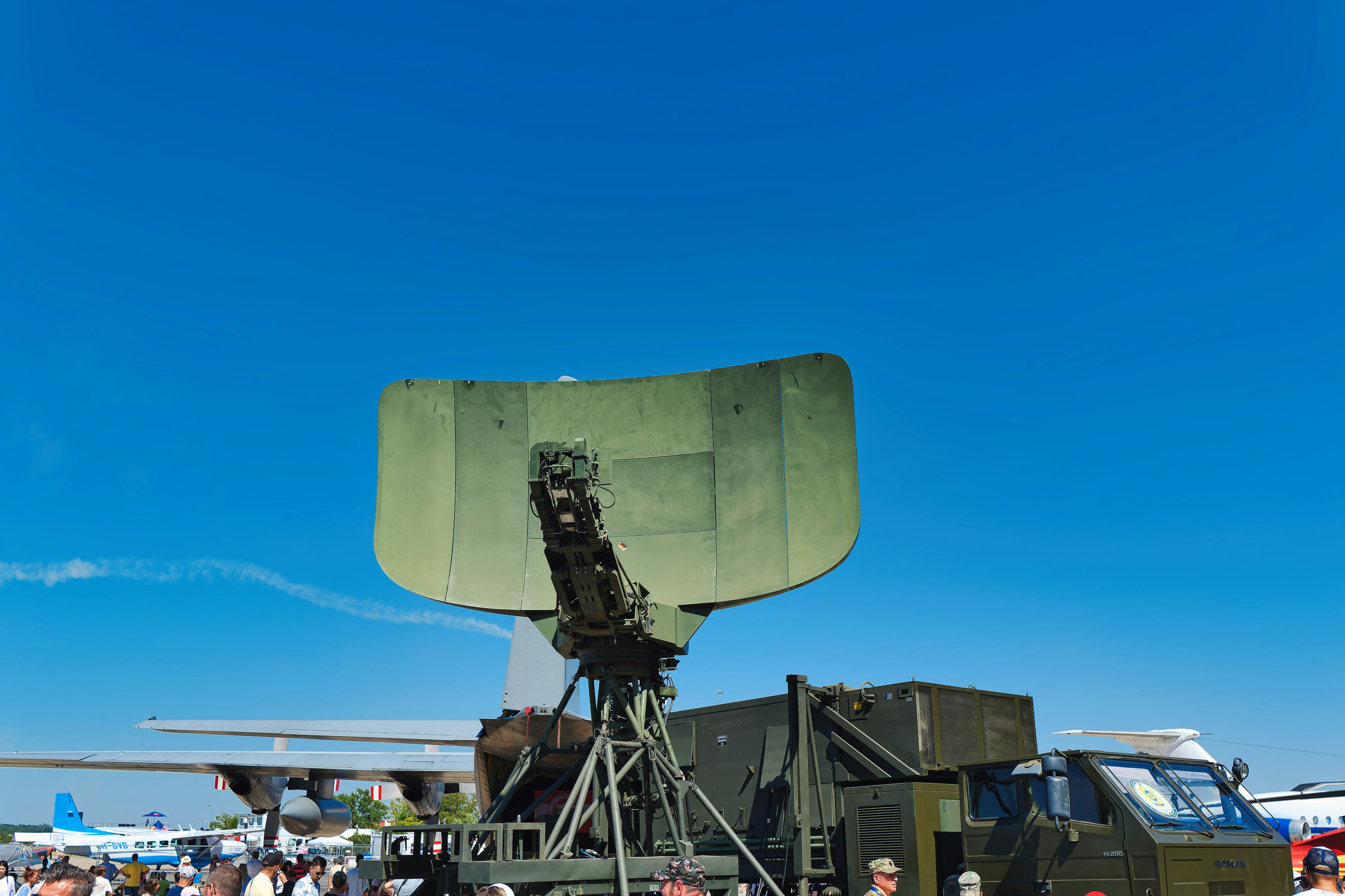 Military radar dish on a vehicle outdoors