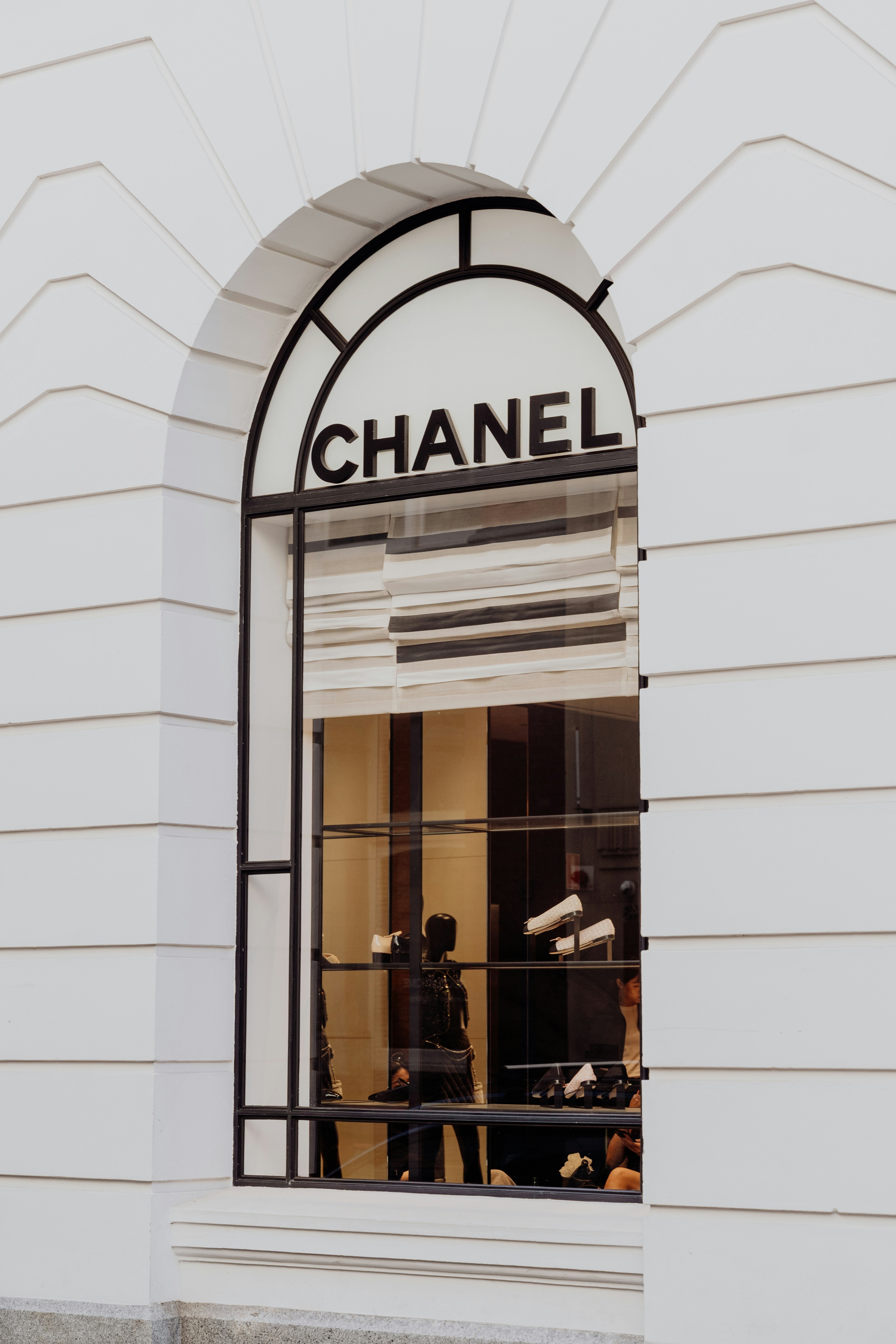 Chanel store window with arched architectural details