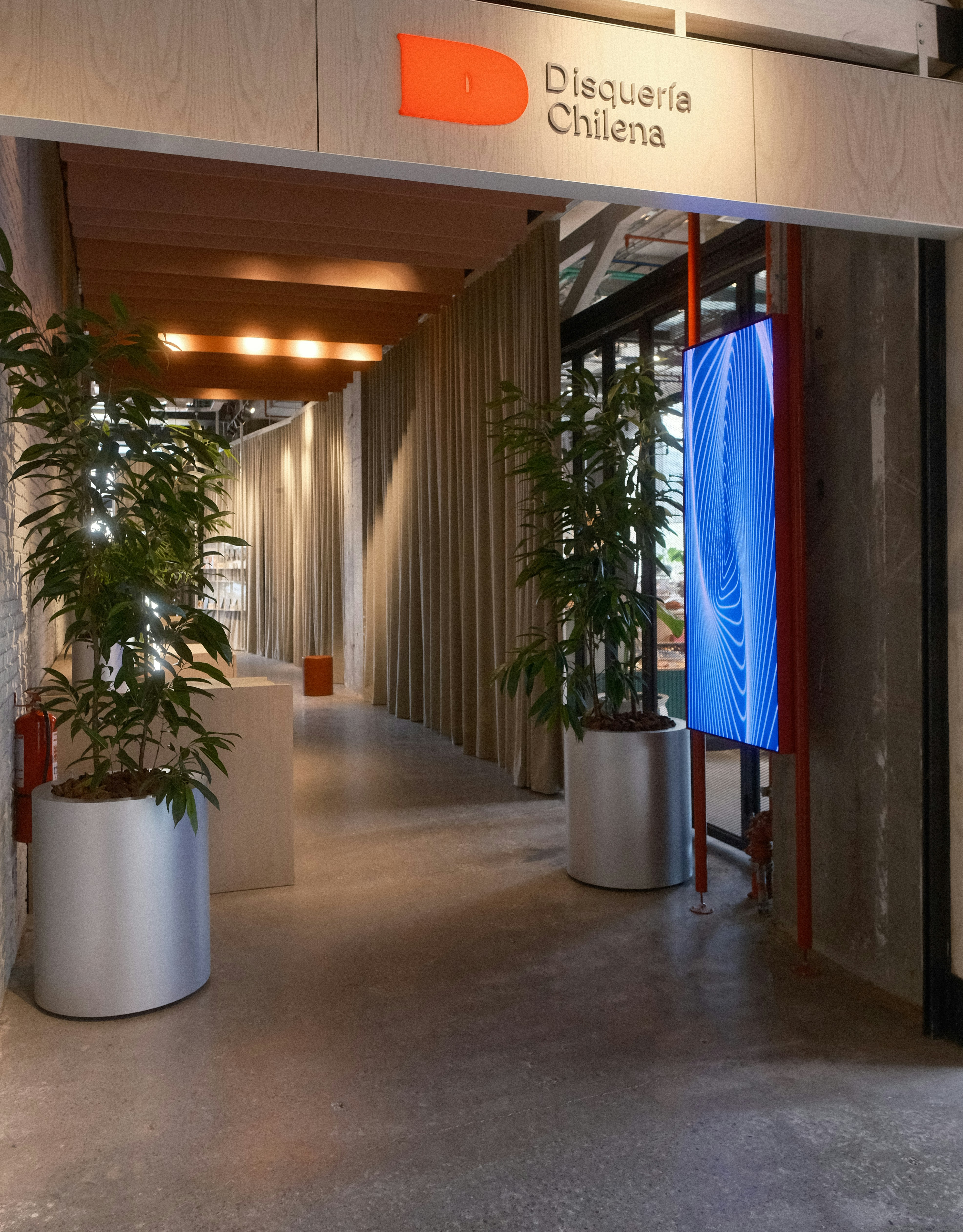 Modern hallway with plants and digital display