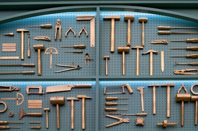 Collection of various brass woodworking tools displayed neatly.