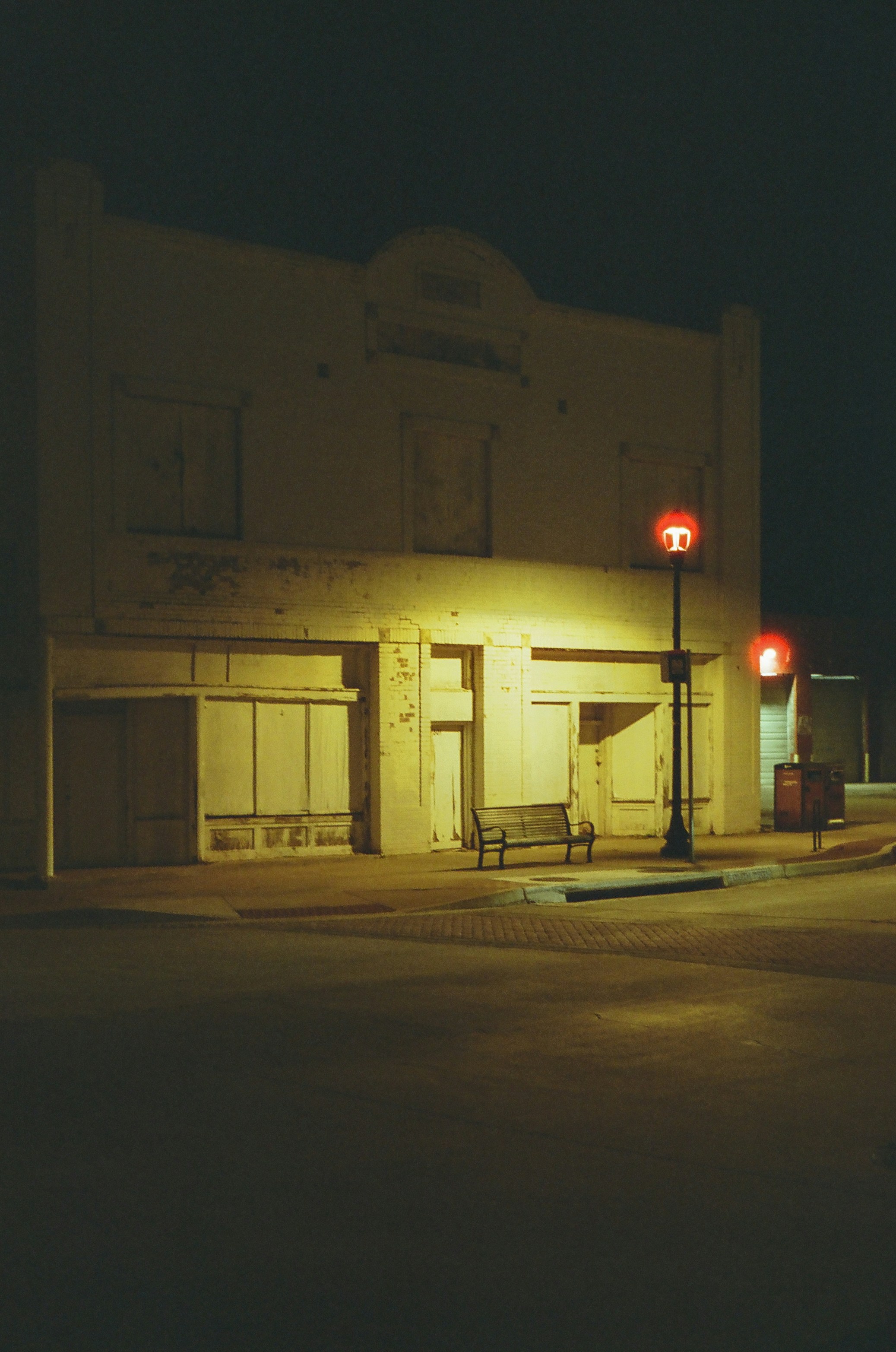 Deserted building on a street at night