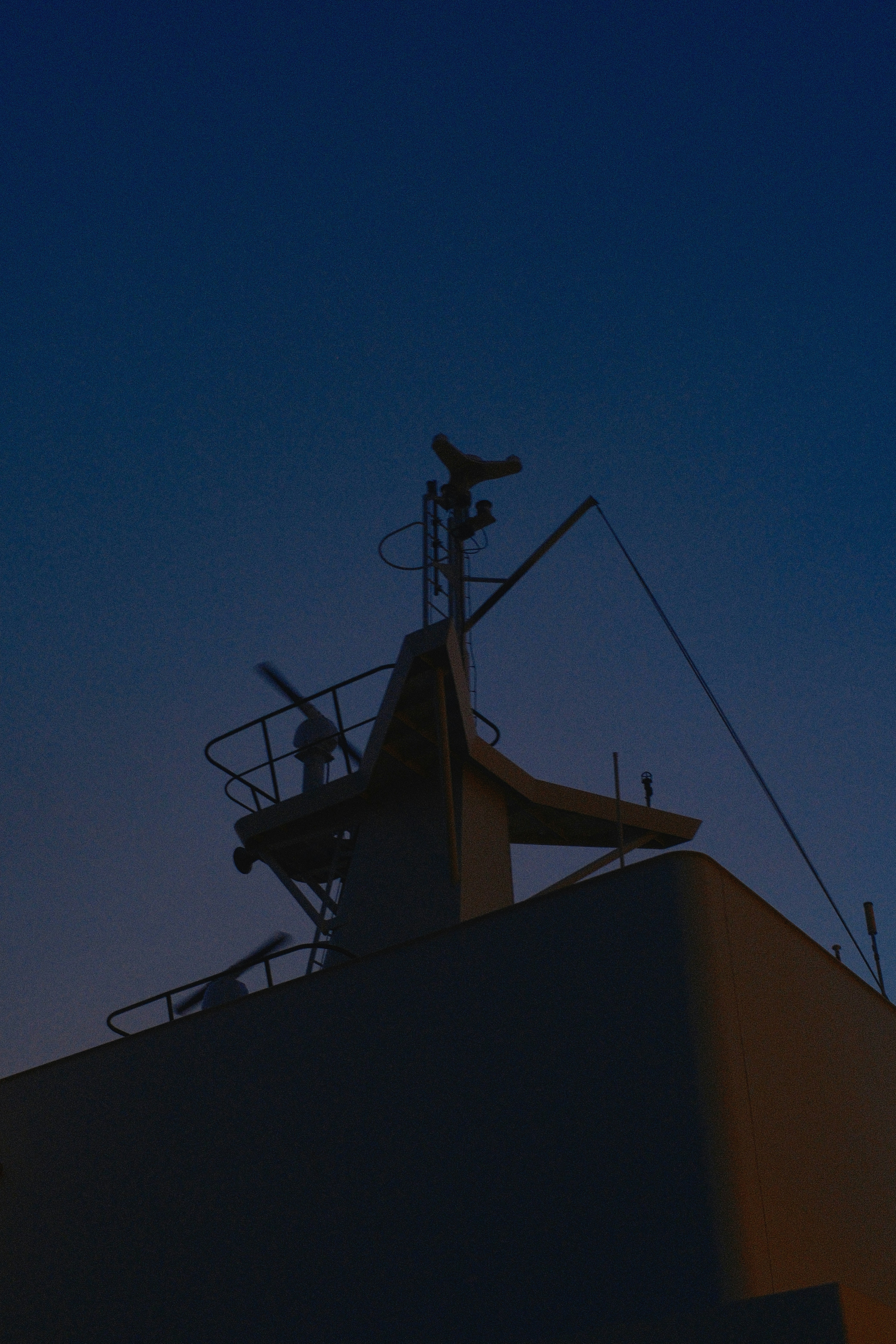 Ship's bridge against a twilight sky