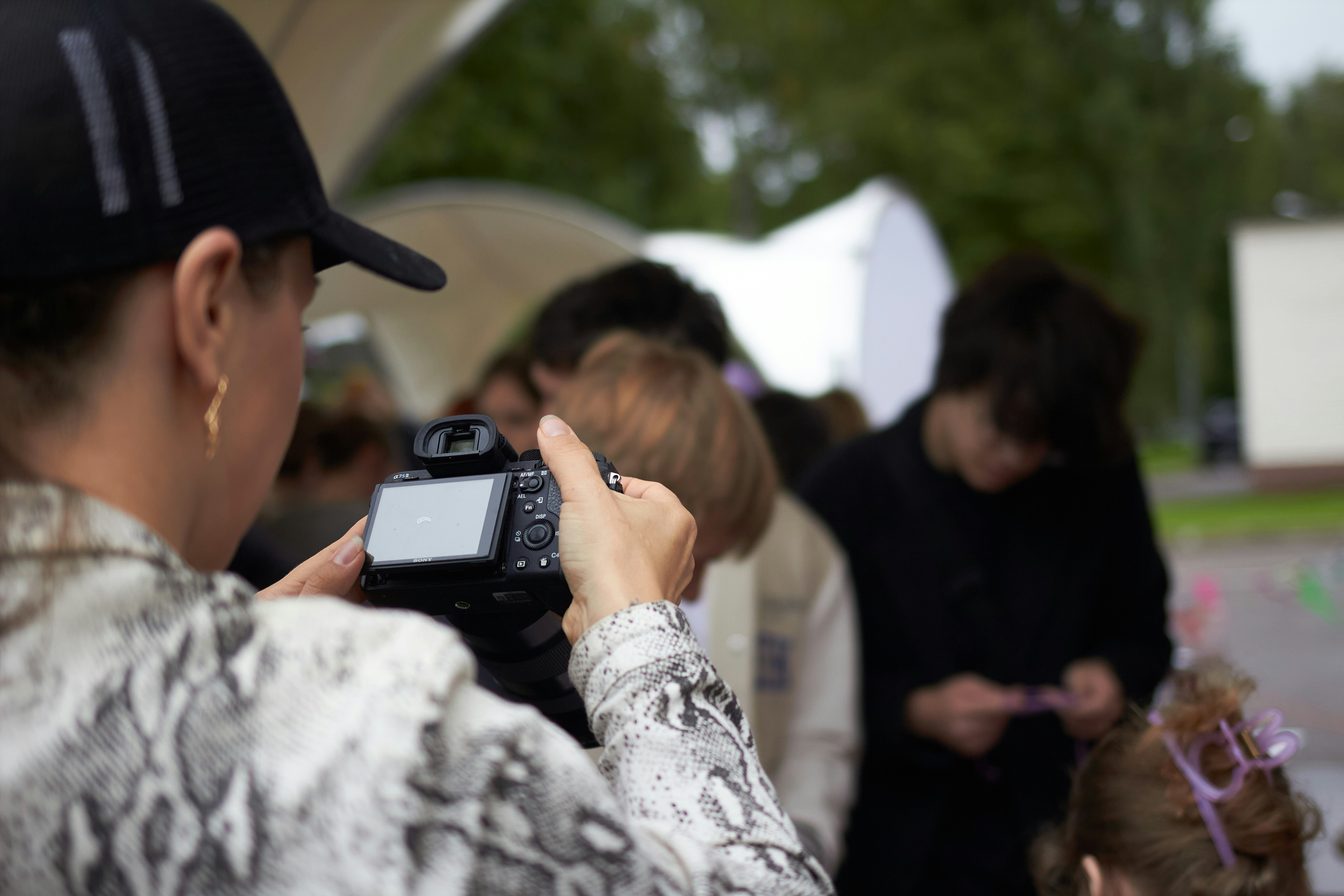 How to Spot When a Celebrity Cameo Is Just a Paid Promotion – Woman taking a picture of a dog with glasses.
