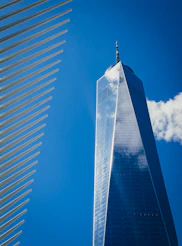 Modern skyscraper against a bright blue sky