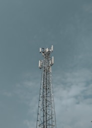 Cell tower against a cloudy sky
