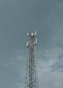 Cell tower against a cloudy sky
