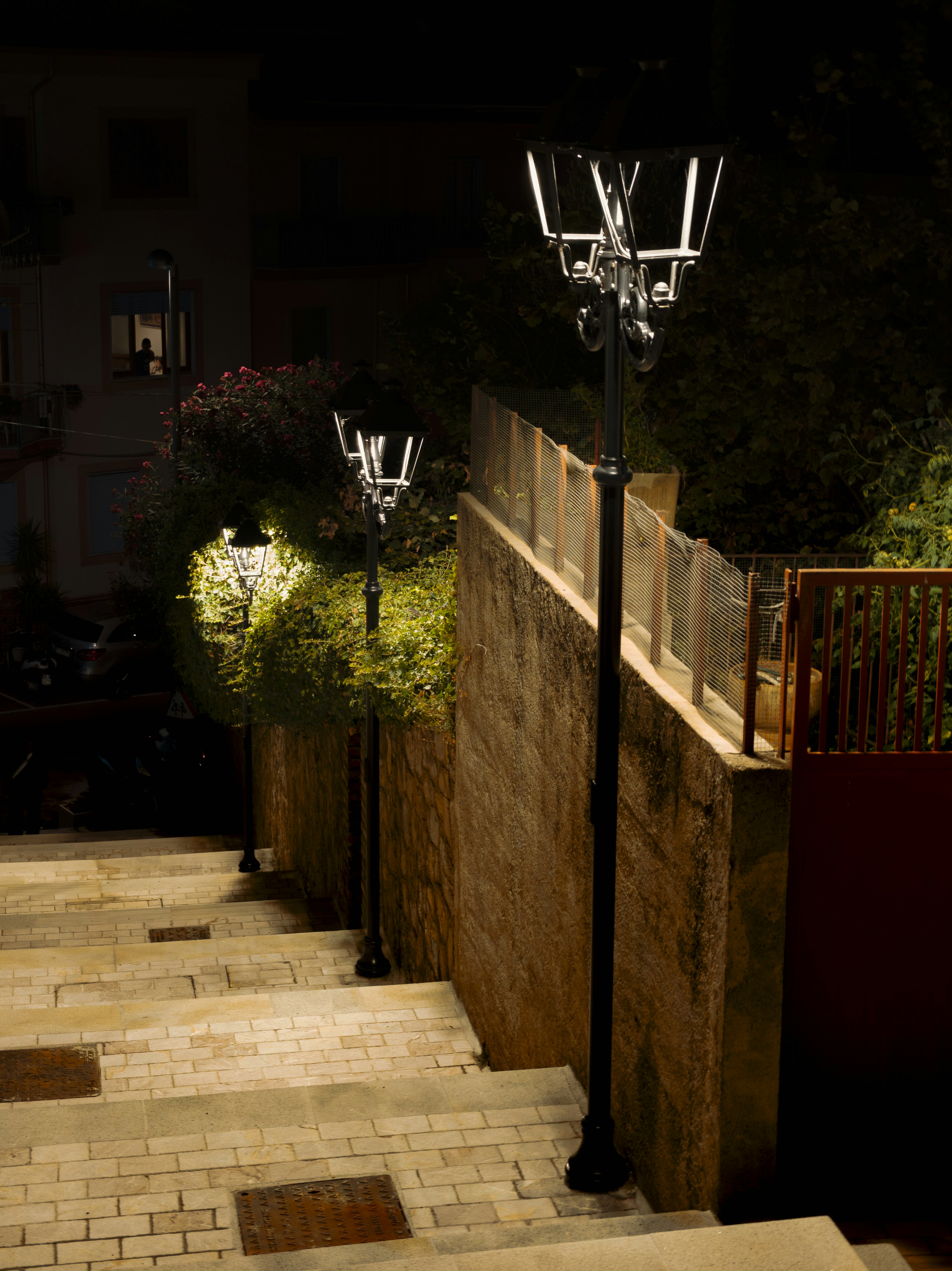 Stone staircase illuminated by streetlights at night
