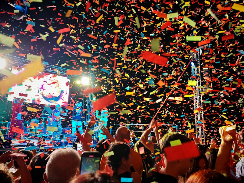 Confetti burst over concert crowd