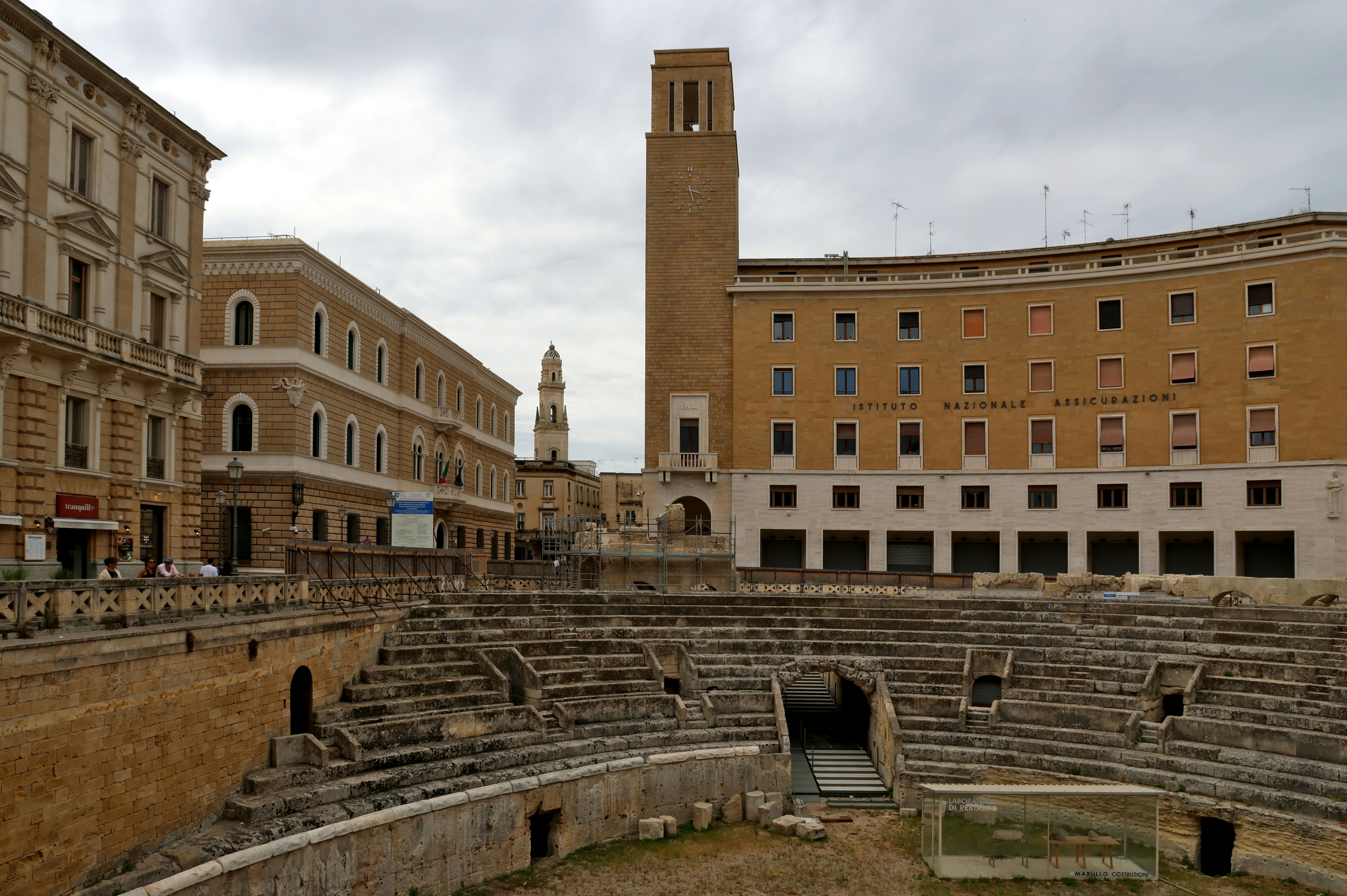 Ancient roman amphitheater with surrounding buildings