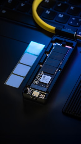 Disassembled ssd drive with memory chips and circuit board.