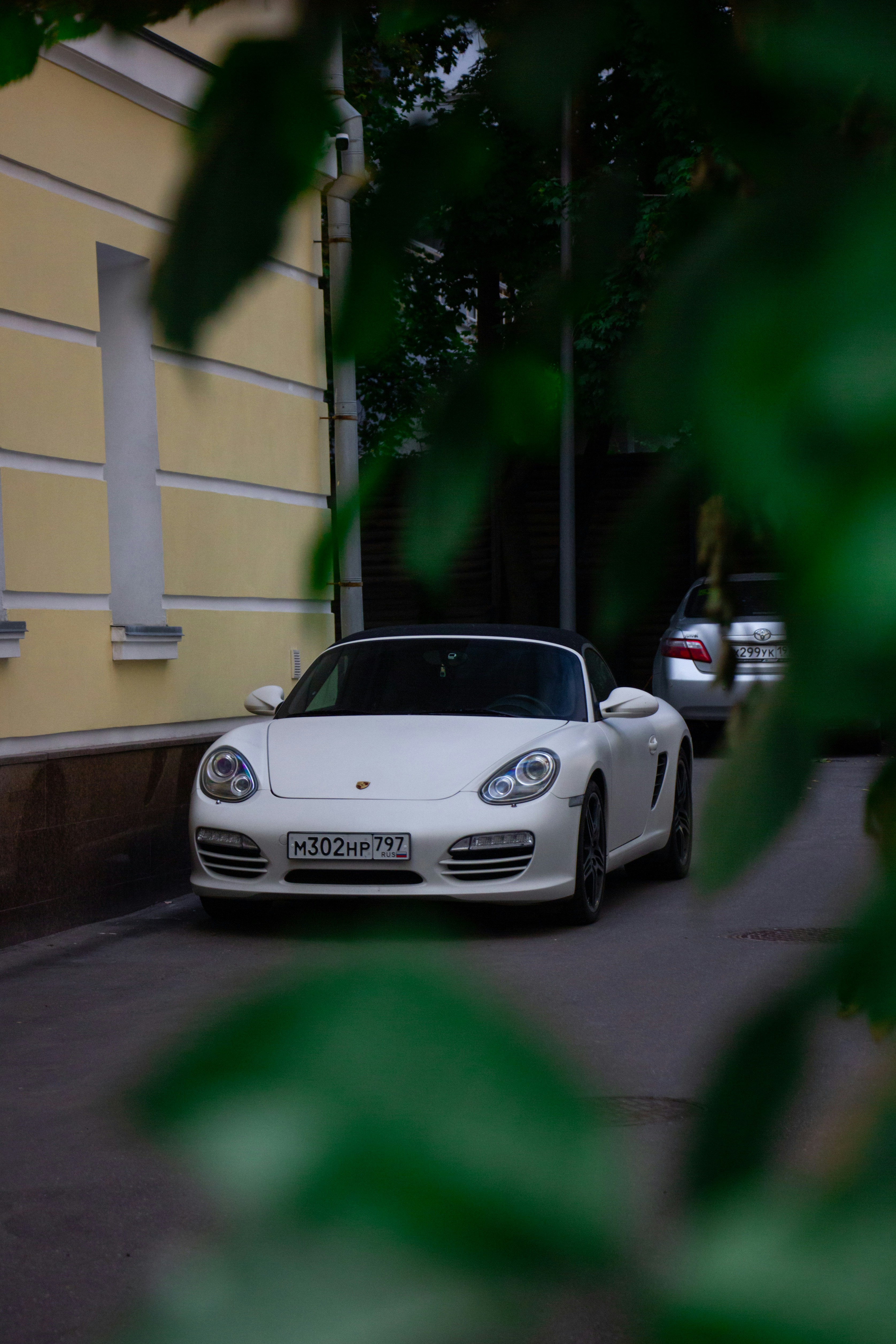 White convertible sports car parked on street