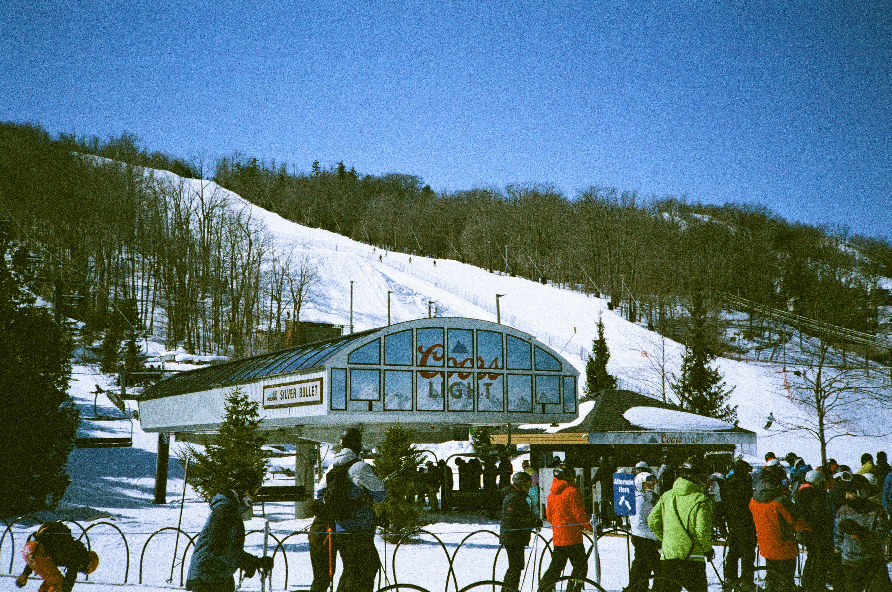 Ski resort with a busy chairlift and snowy slopes