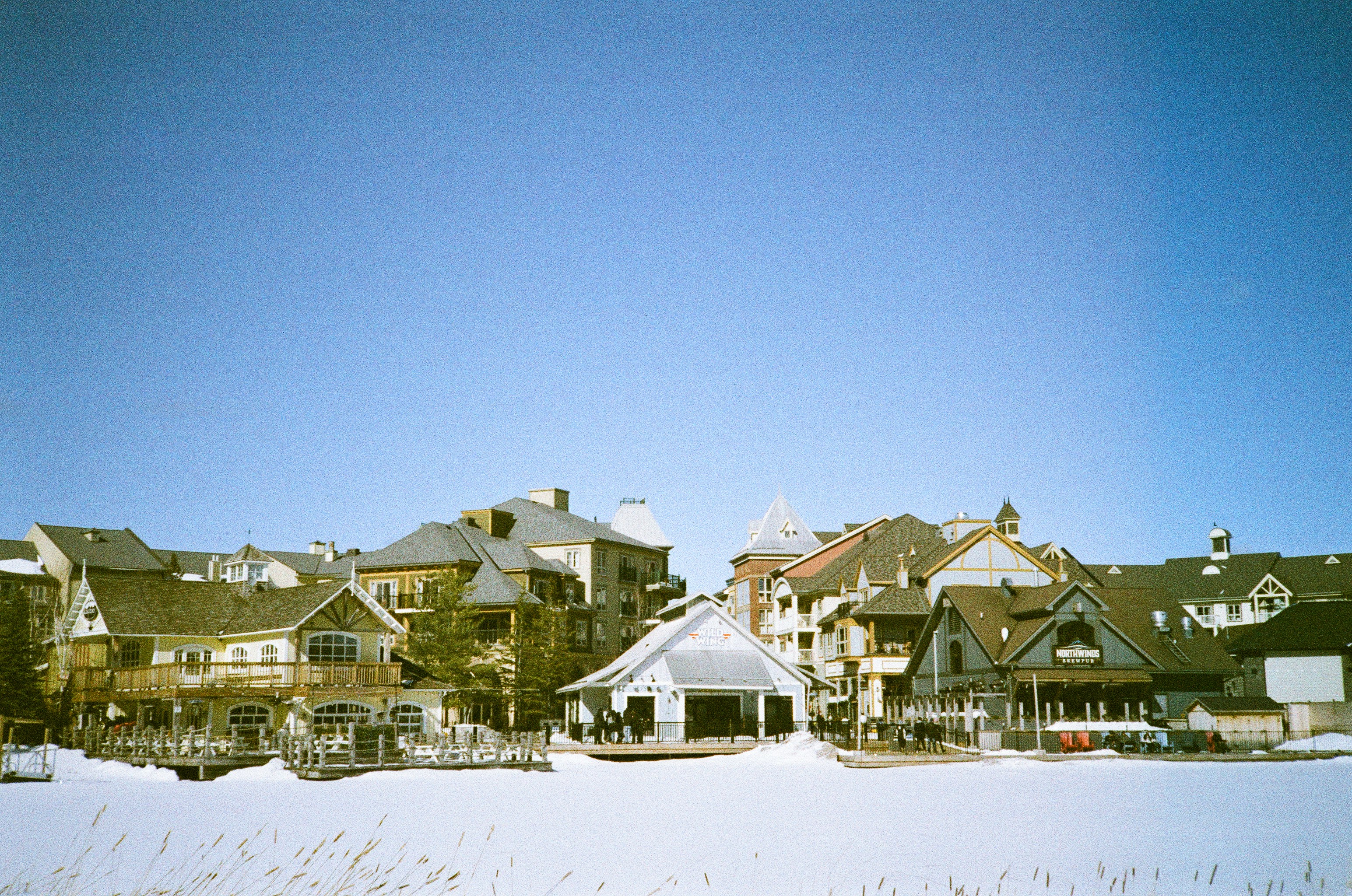 Snowy village with traditional european-style buildings.