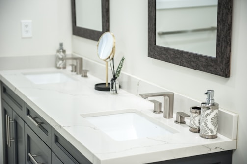 Modern double vanity with sinks and mirrors.