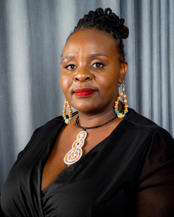 @kemi_t wearing Brass hoop earrings