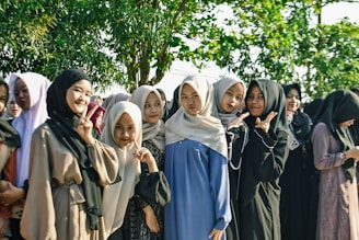 Group of young women wearing hijabs smiling