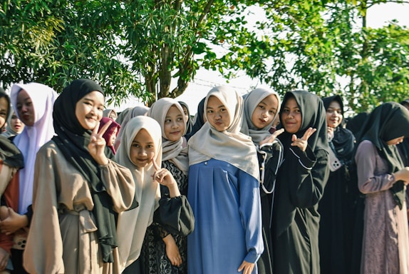 Group of young women wearing hijabs smiling