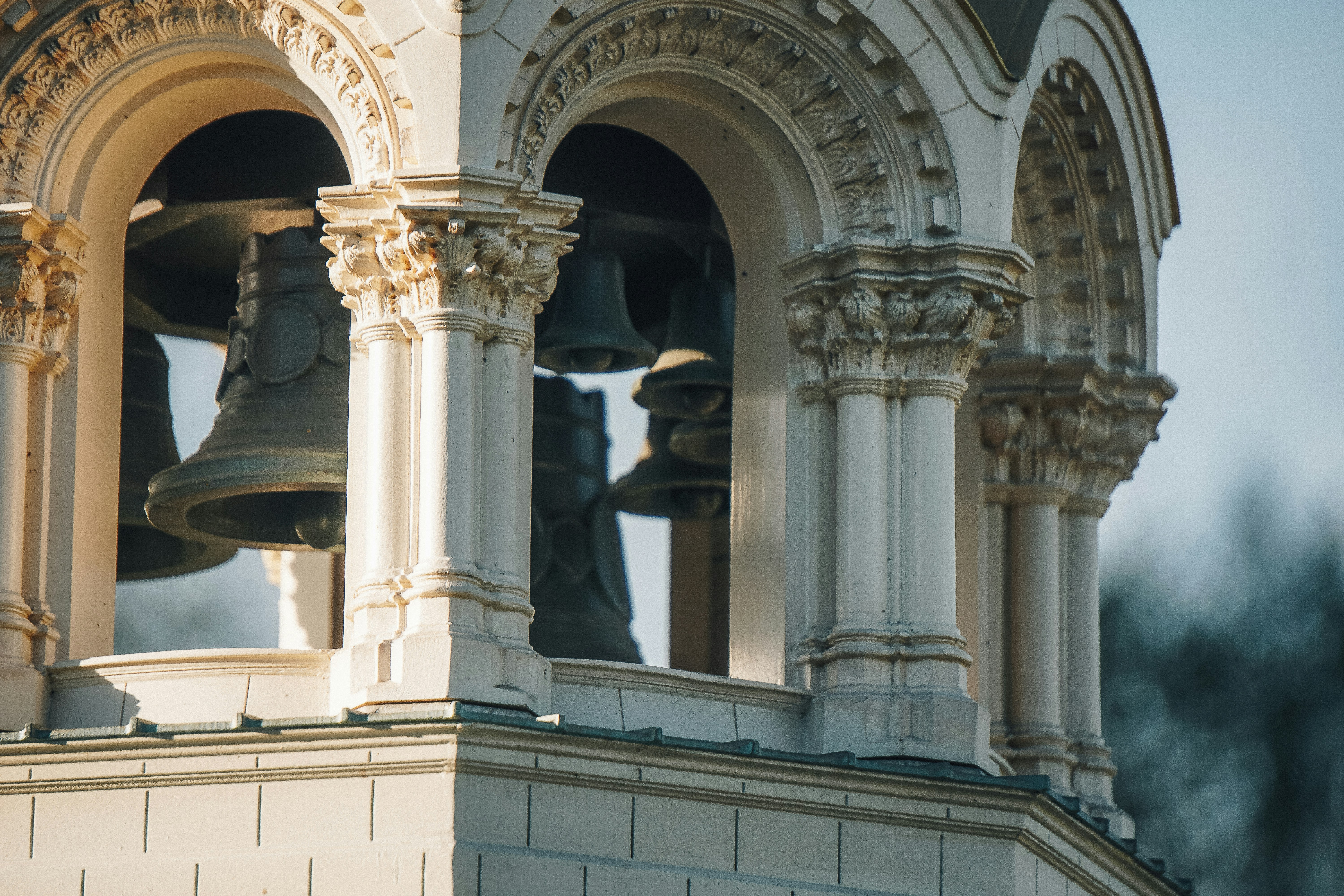 Large bells hang in a church bell tower