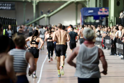 Athletes running in an indoor race event.