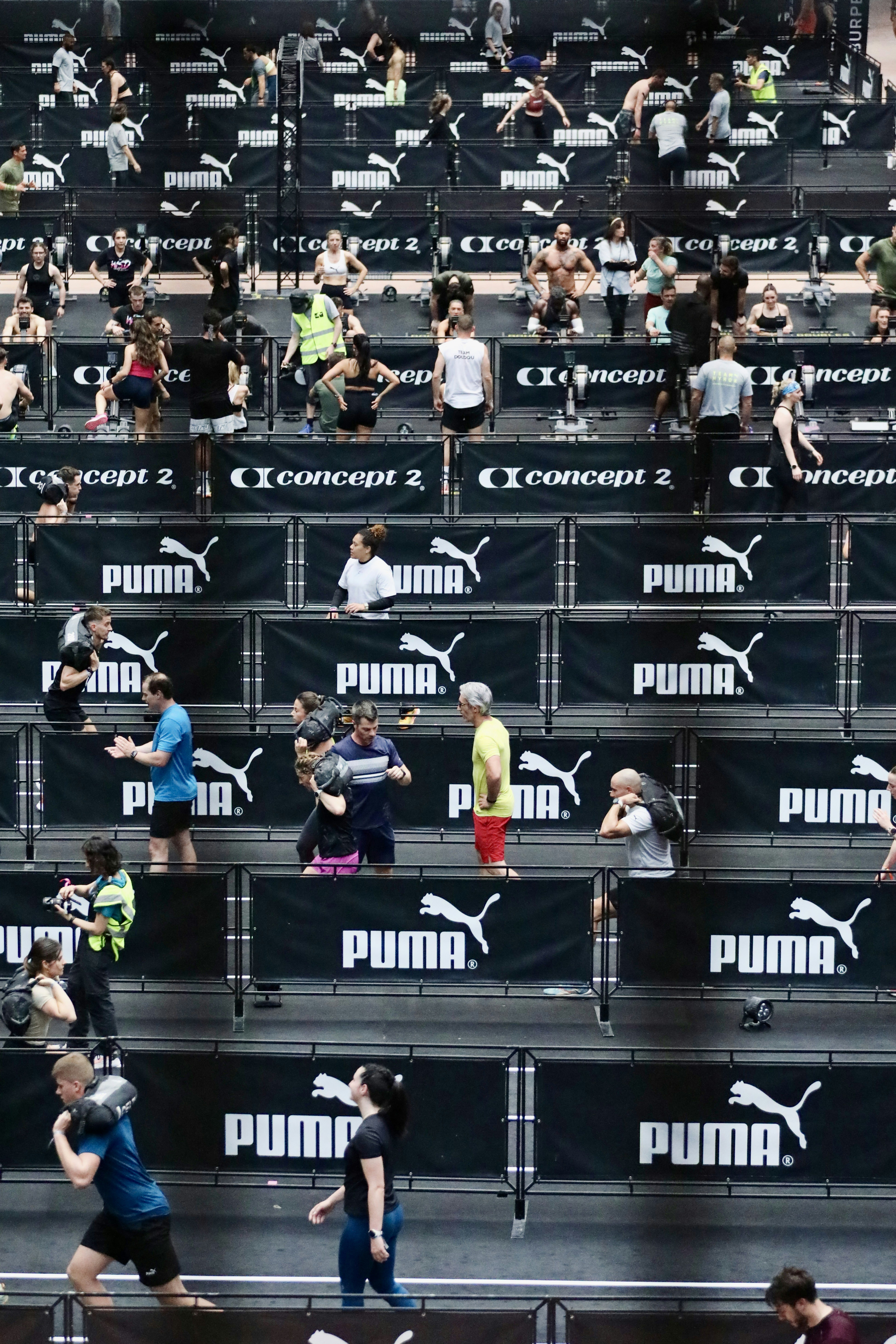 Athletes training in a stadium with puma branding.