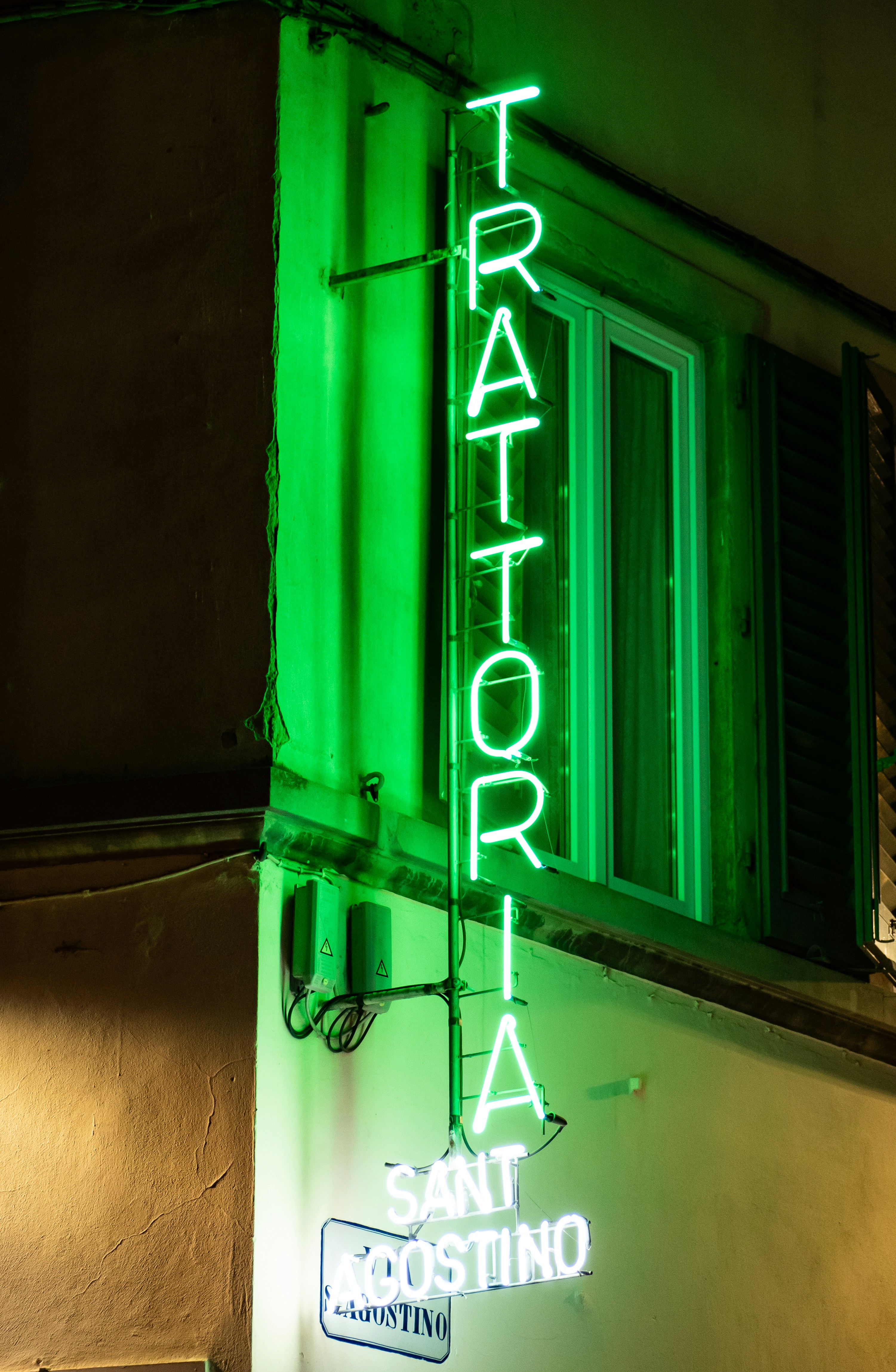 Green neon sign for trattoria sant' agostino