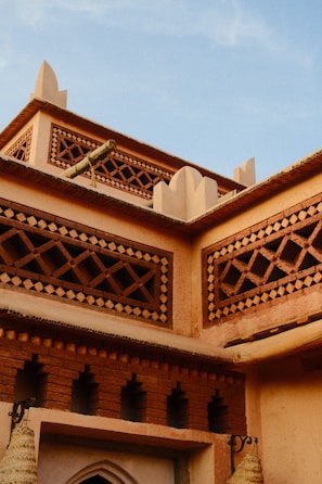 Ornate moroccan architecture with intricate latticework details.