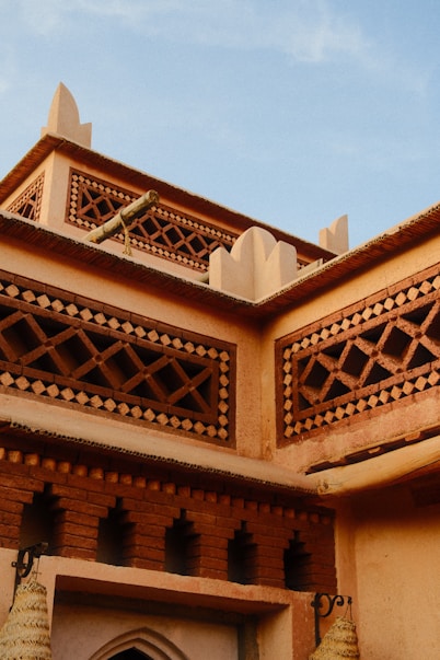 Ornate moroccan architecture with intricate latticework details.