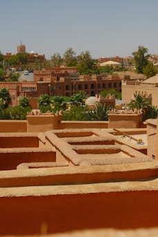 Terraced buildings and lush greenery in a desert city.
