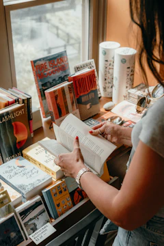 Woman reading a book among many others