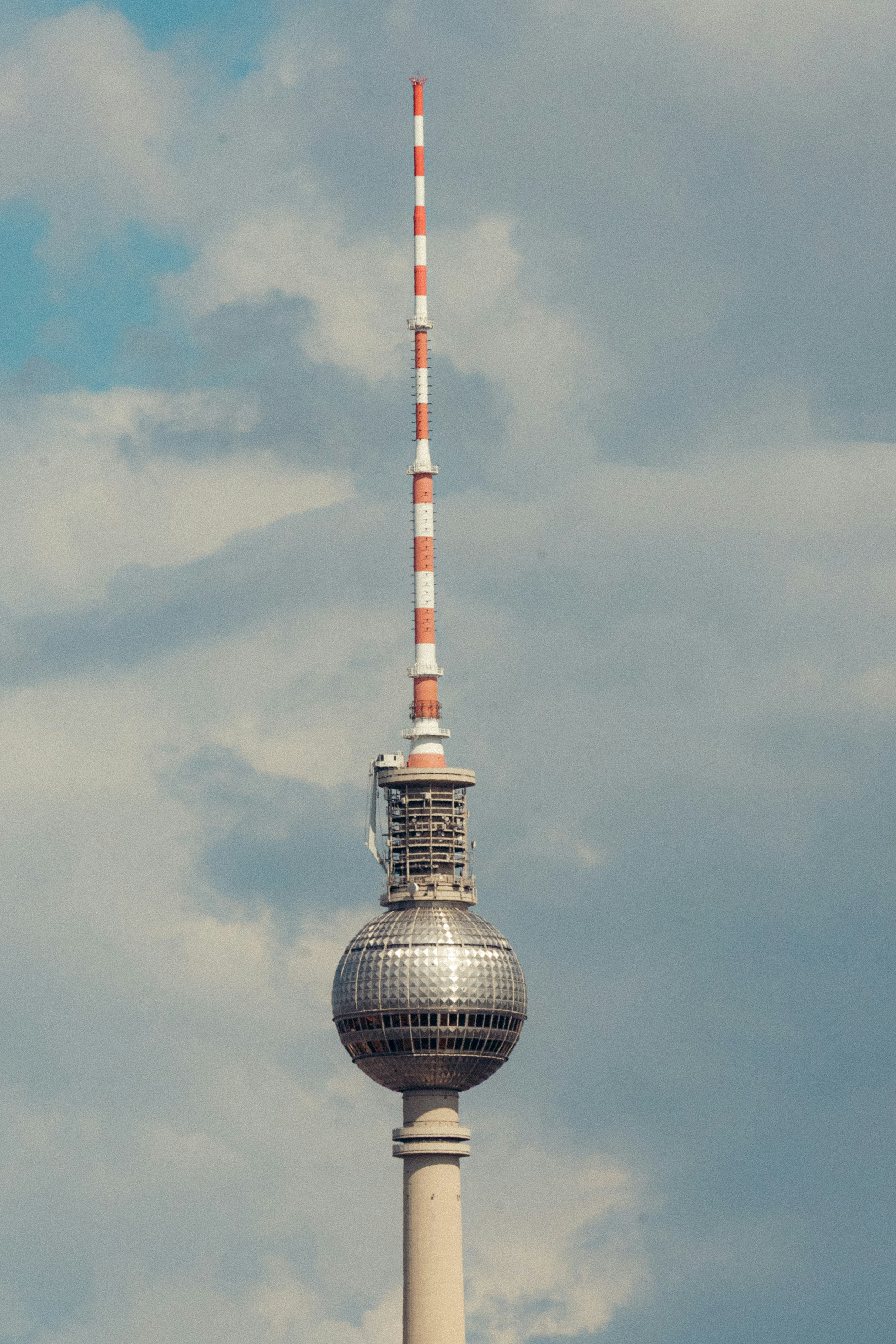 Tall television tower with red and white stripes
